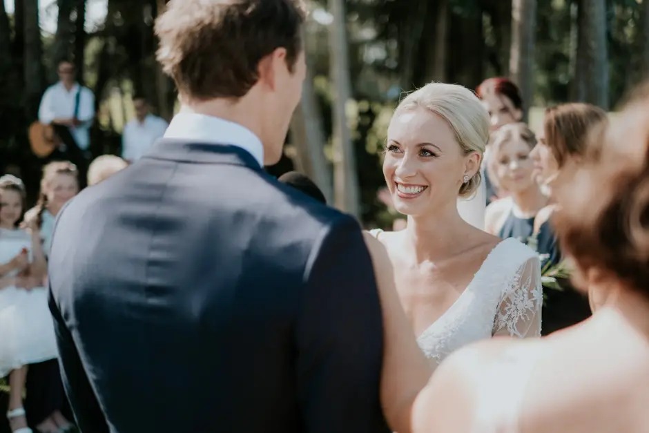 Jessica and Jarrod smiling at each other during the vows, Goremans Road