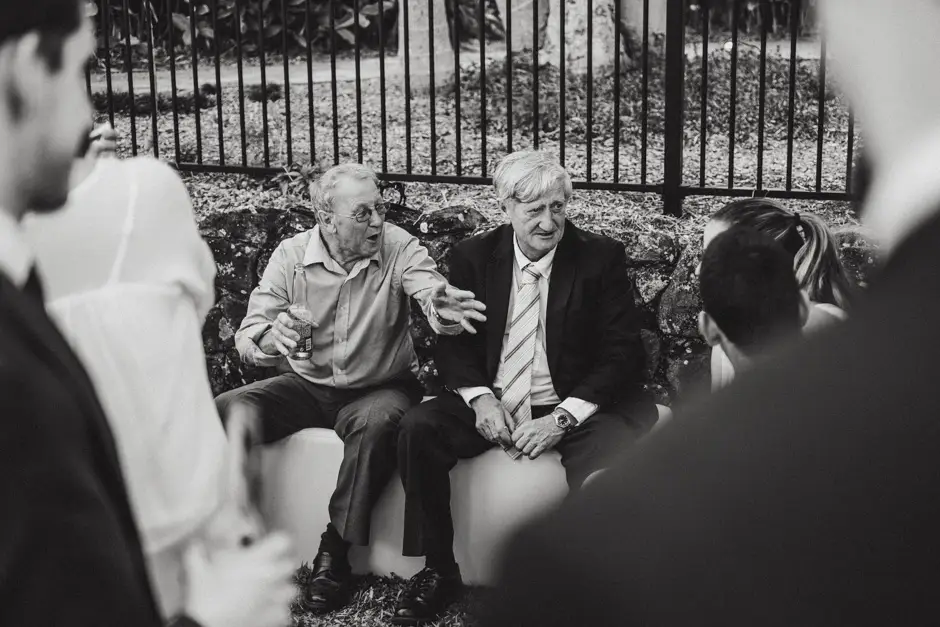 Two older guests talking together during the drinks hour, Goremans Road