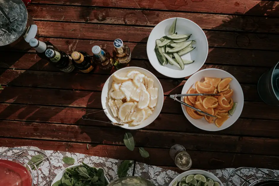 Sliced citrus, olives and dips laid out on a timber table, Goremans Road