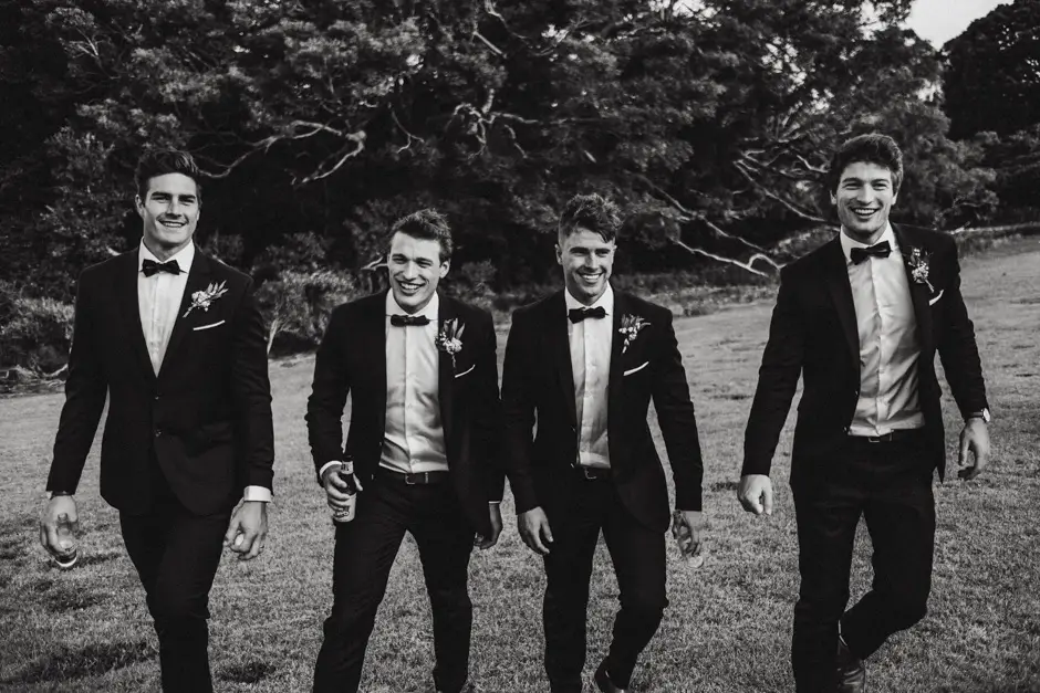The groomsmen walking together in black tie, Eureka