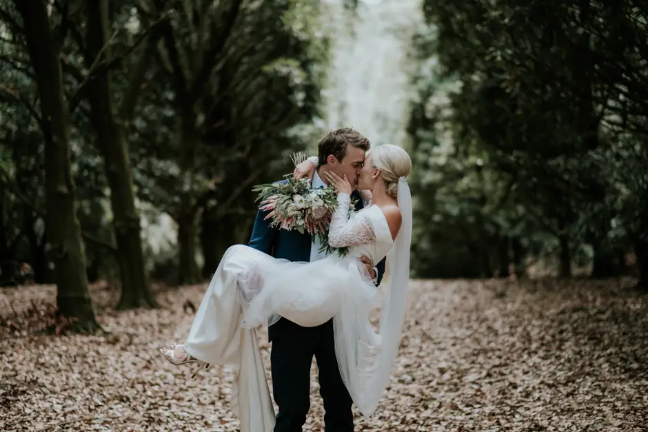 Jarrod carrying Jessica among the fallen leaves, Goremans Road