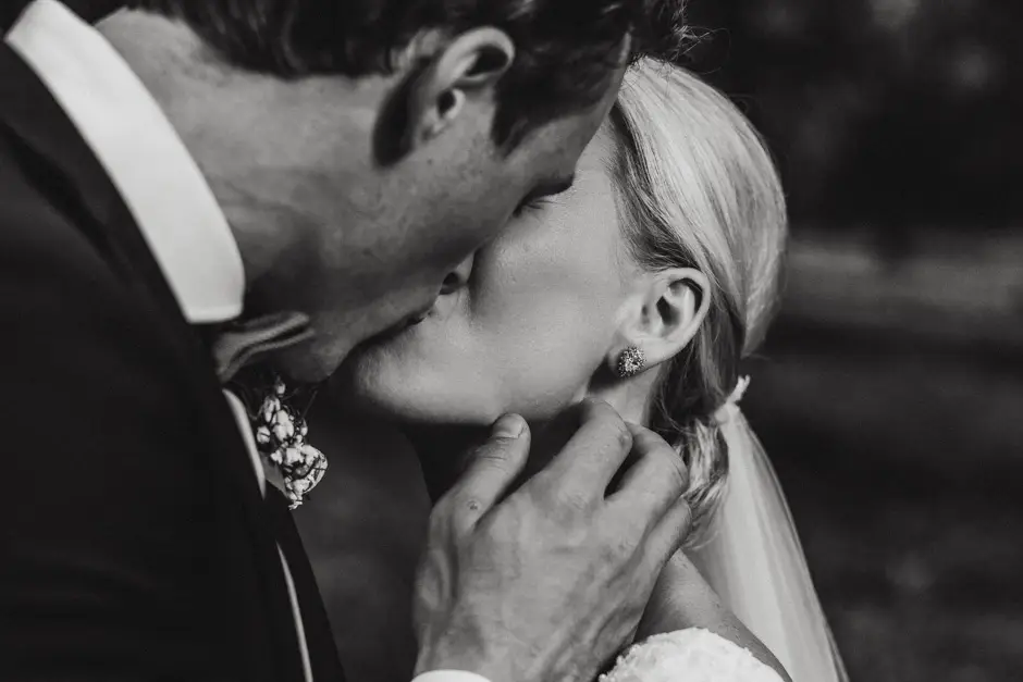 A close portrait of Jessica and Jarrod kissing, Eureka
