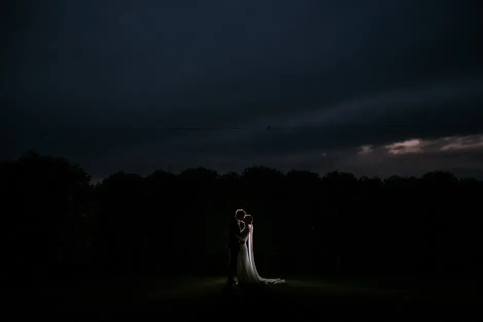 Jessica and Jarrod lit alone in the dark paddock, Eureka