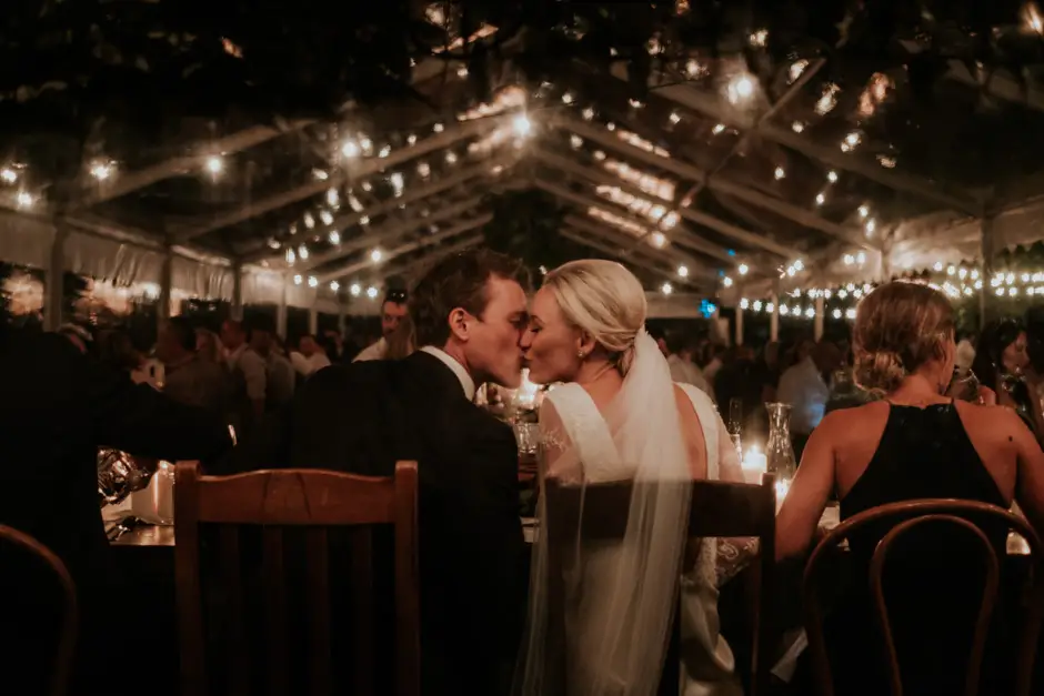 Jessica and Jarrod together at the table under the festoon lights, Eureka