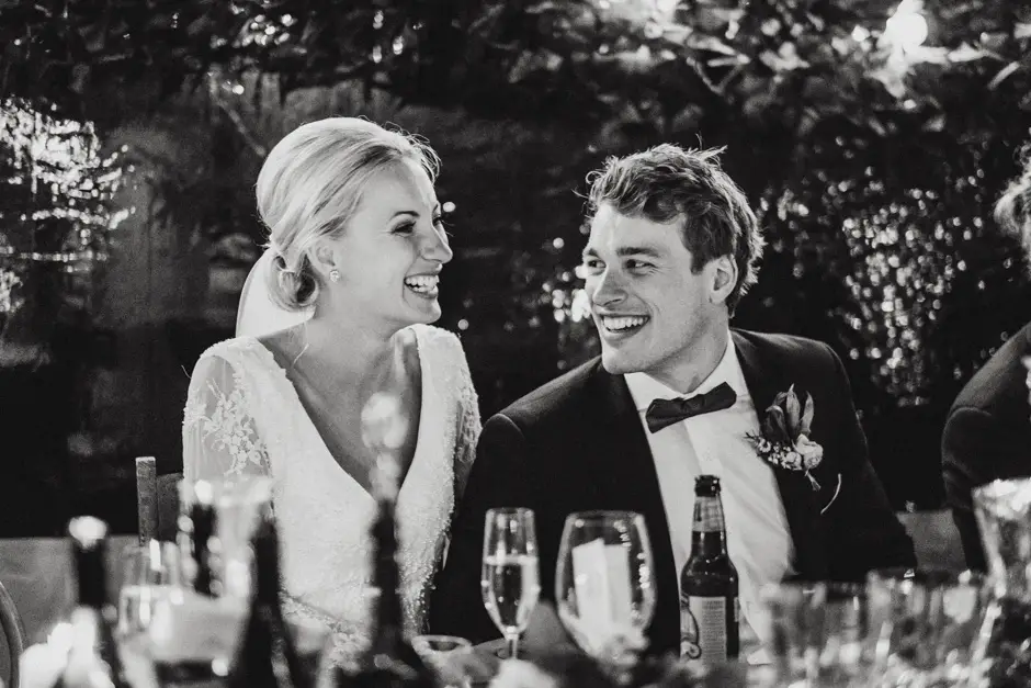Jessica and Jarrod laughing at the top table, Goremans Road