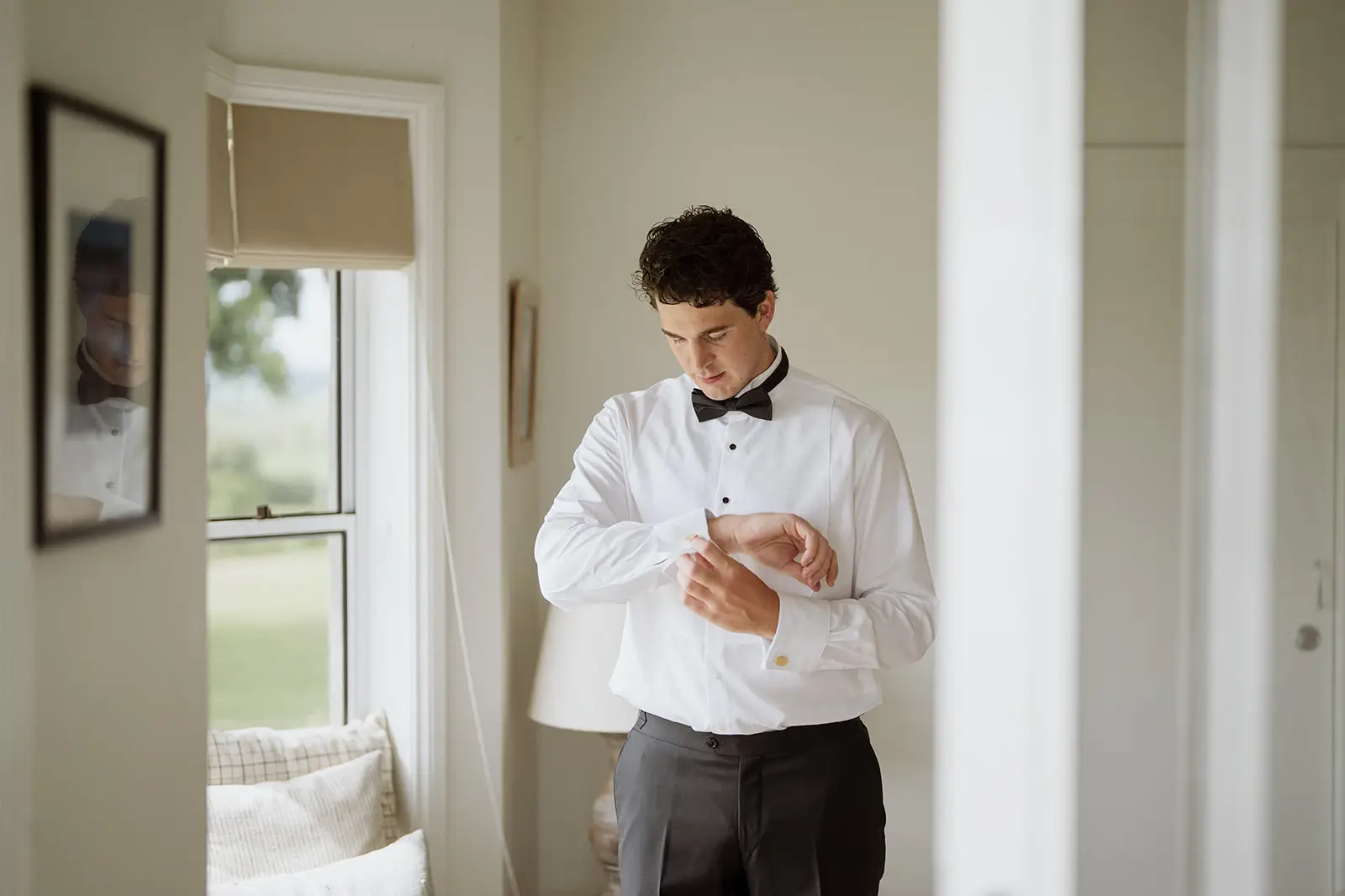 Tom fastening his shirt before the wedding, Byron Bay hinterland