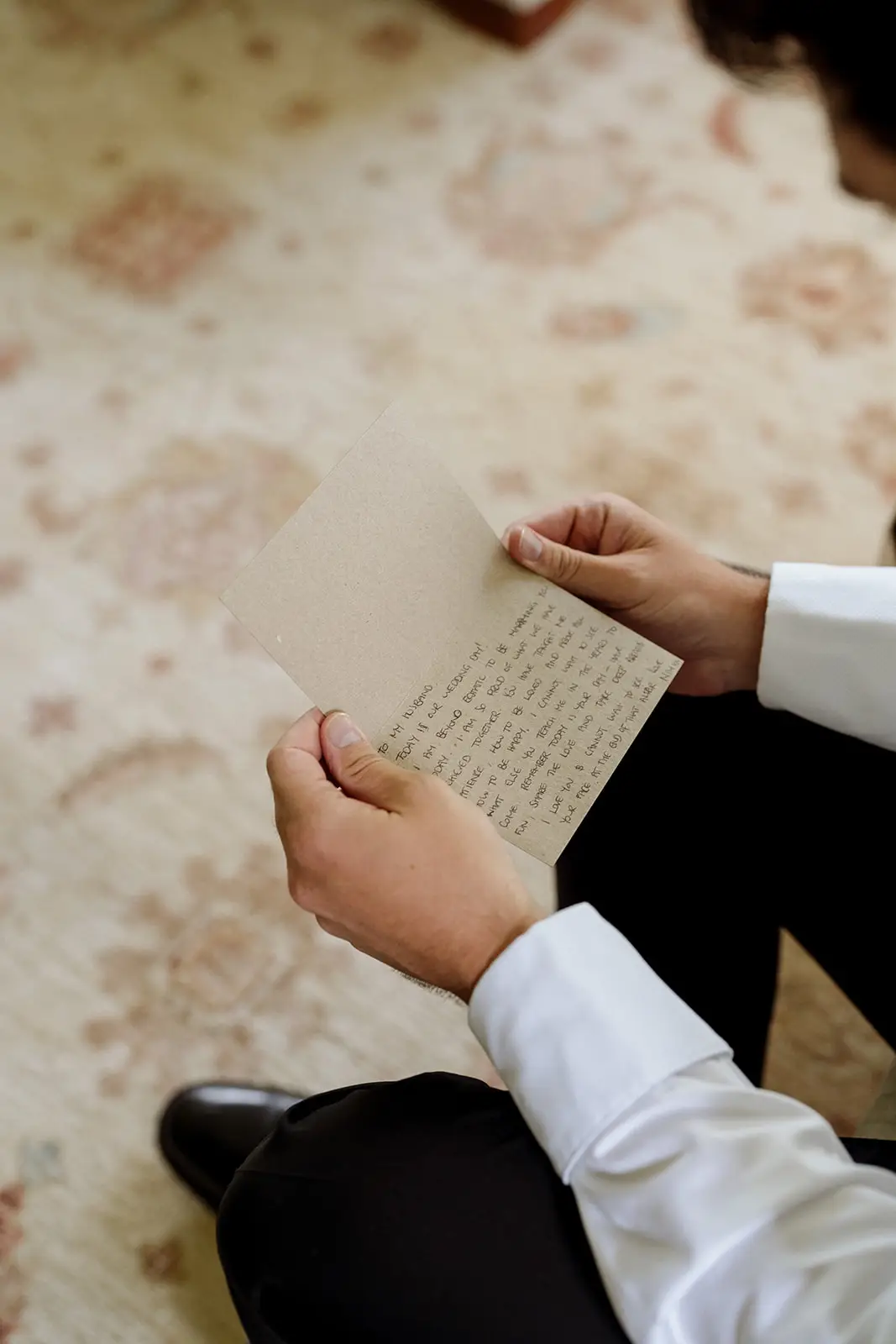 Reading a handwritten note before the ceremony, Byron Bay hinterland