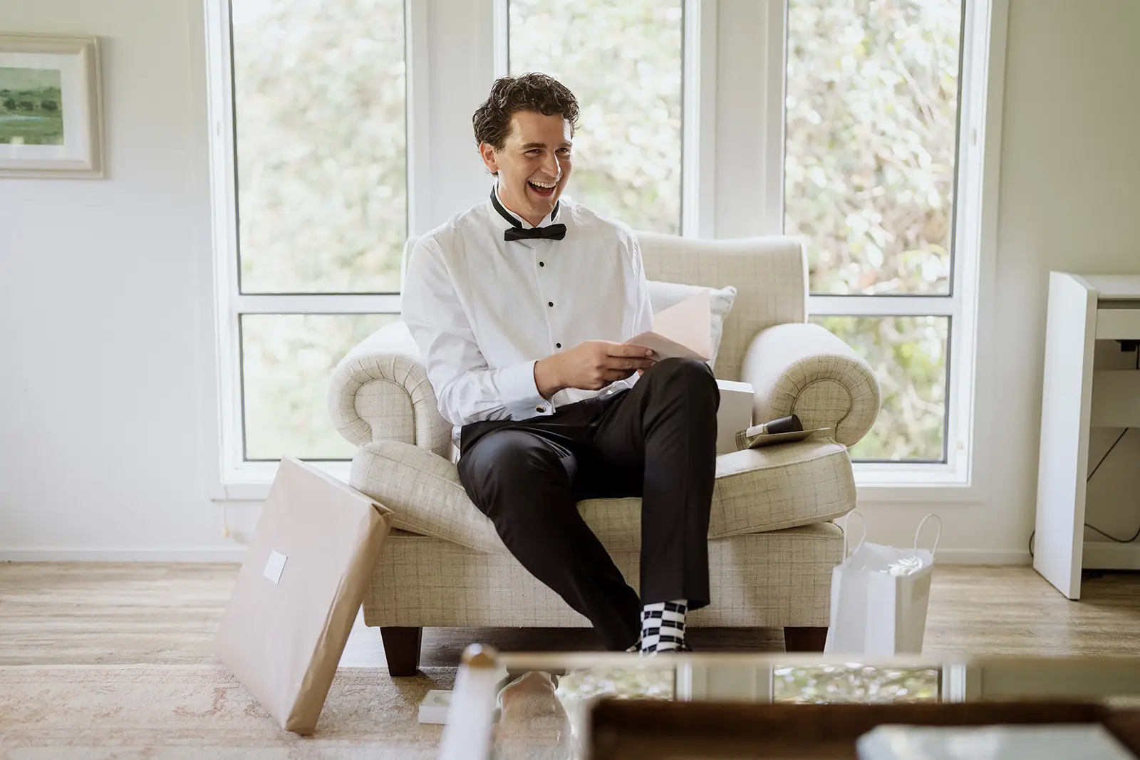 Tom laughing as he opens his present, Byron Bay hinterland