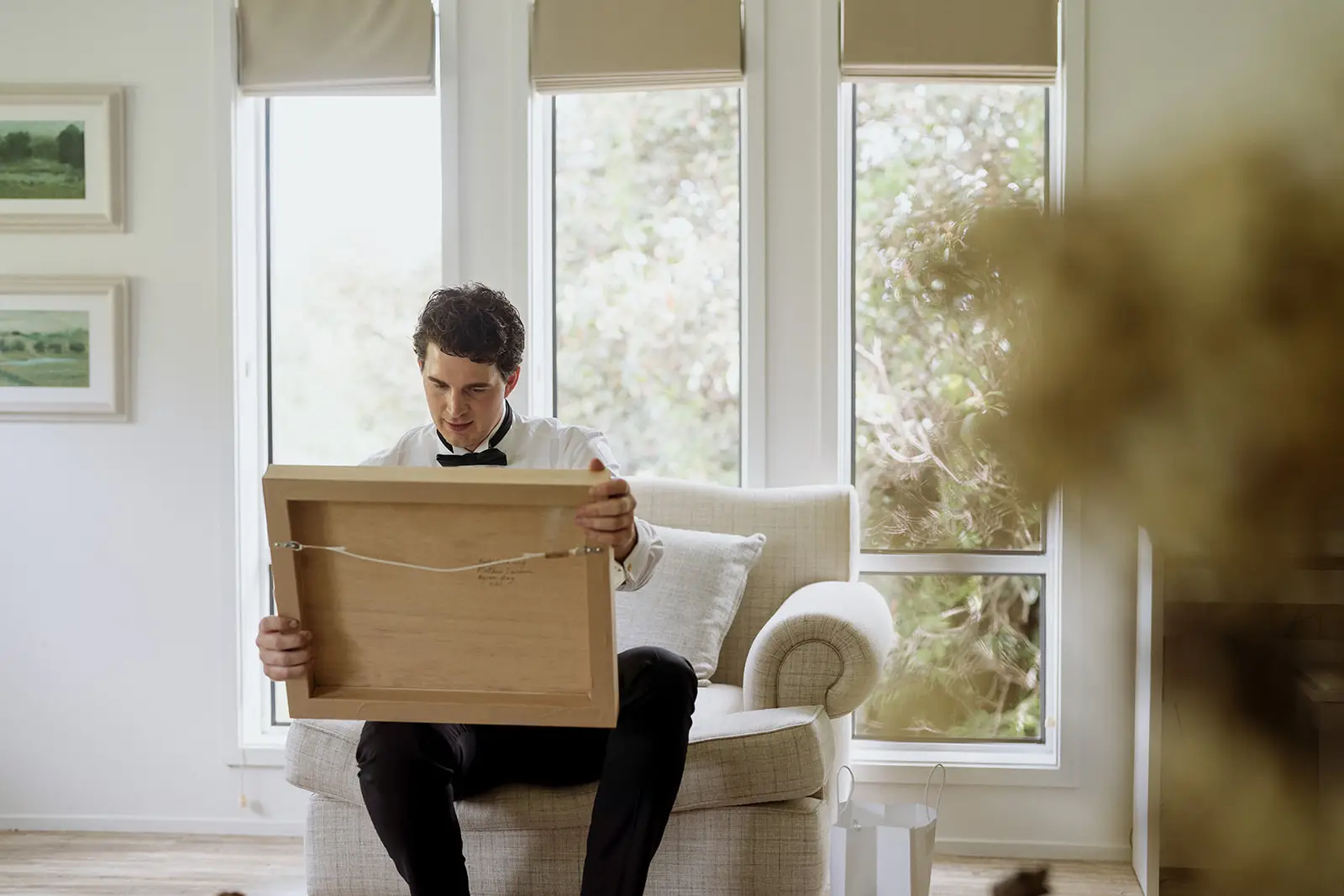 Tom holding the framed gift from Nim, Byron Bay hinterland