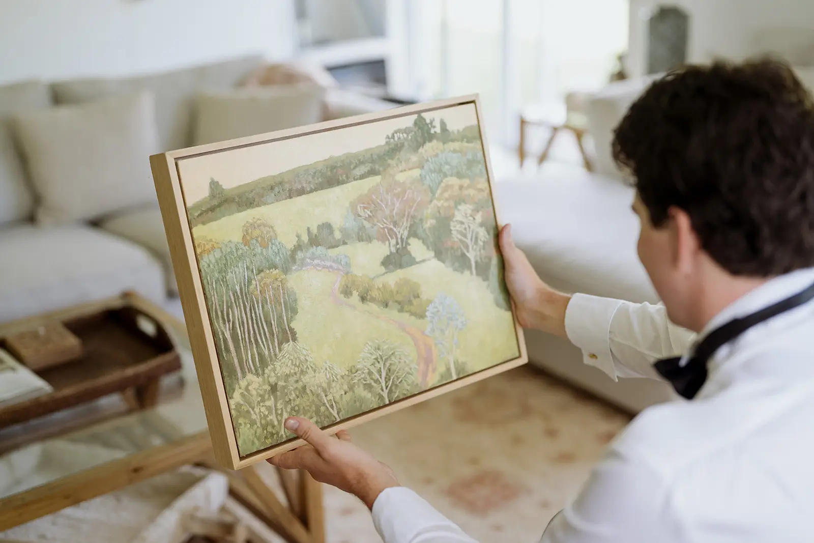 Tom looking at the painting Nim gave him, Byron Bay hinterland
