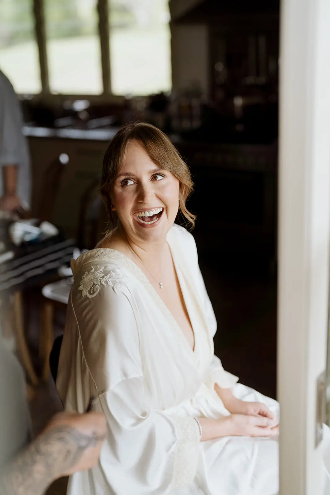 Nim in the window light before getting into her dress, Byron Bay hinterland