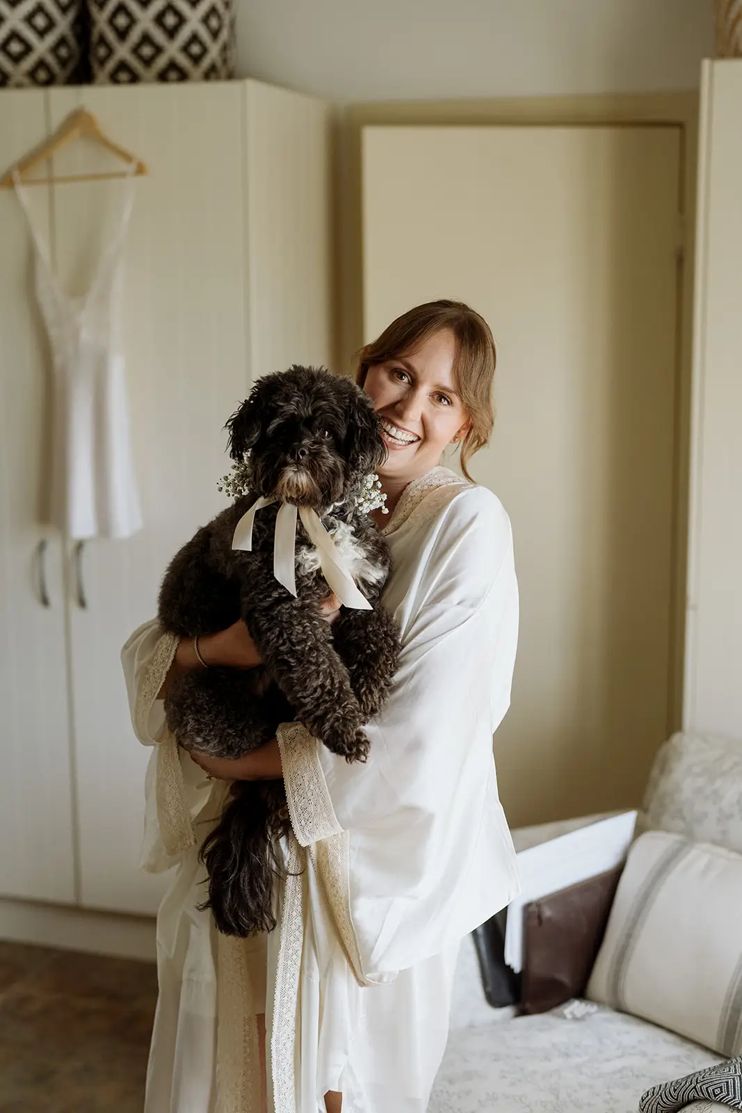 Nim holding her dog before the ceremony, Newrybar