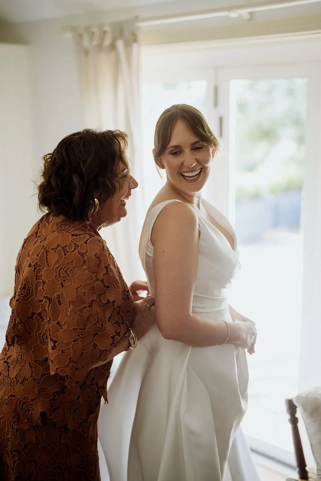 Nim's mother helping her into her gown, Byron Bay hinterland