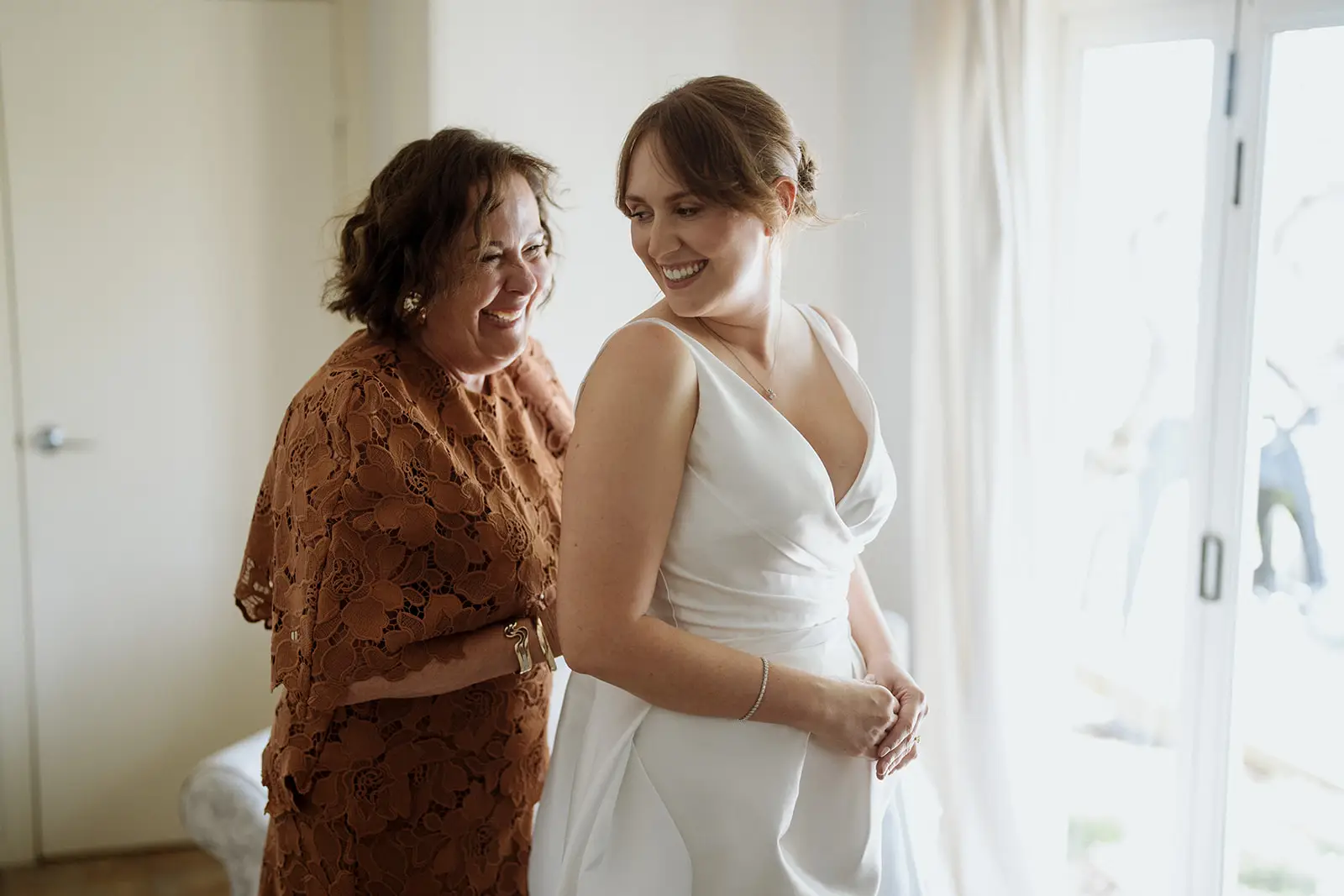 Nim and her mother laughing together before the wedding
