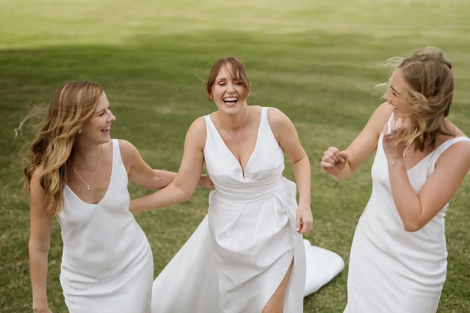Nim running across the grass with her bridesmaids, Newrybar