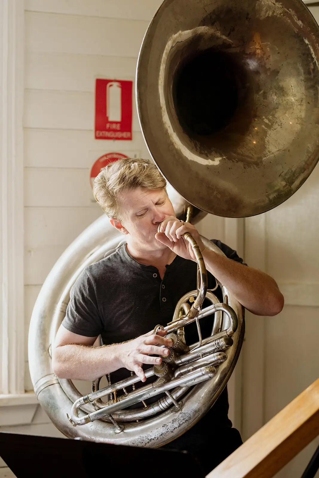 A sousaphone player warming up before the ceremony, Newrybar