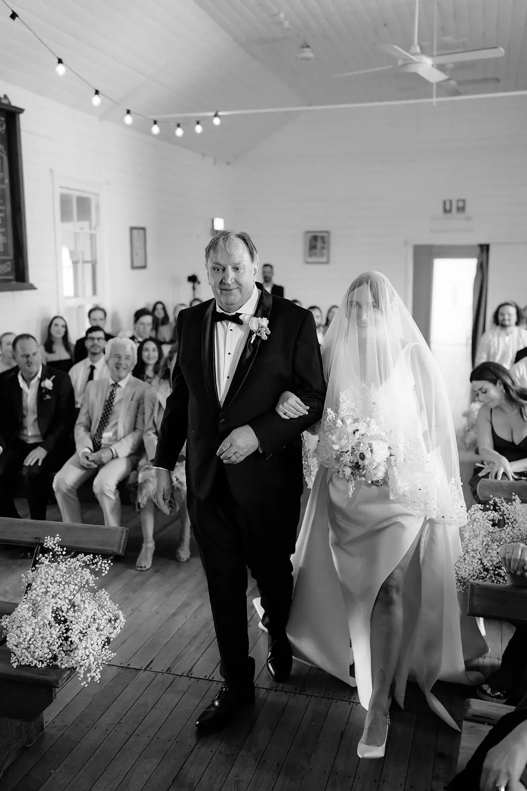 A quiet moment on the walk down the aisle, Newrybar hall