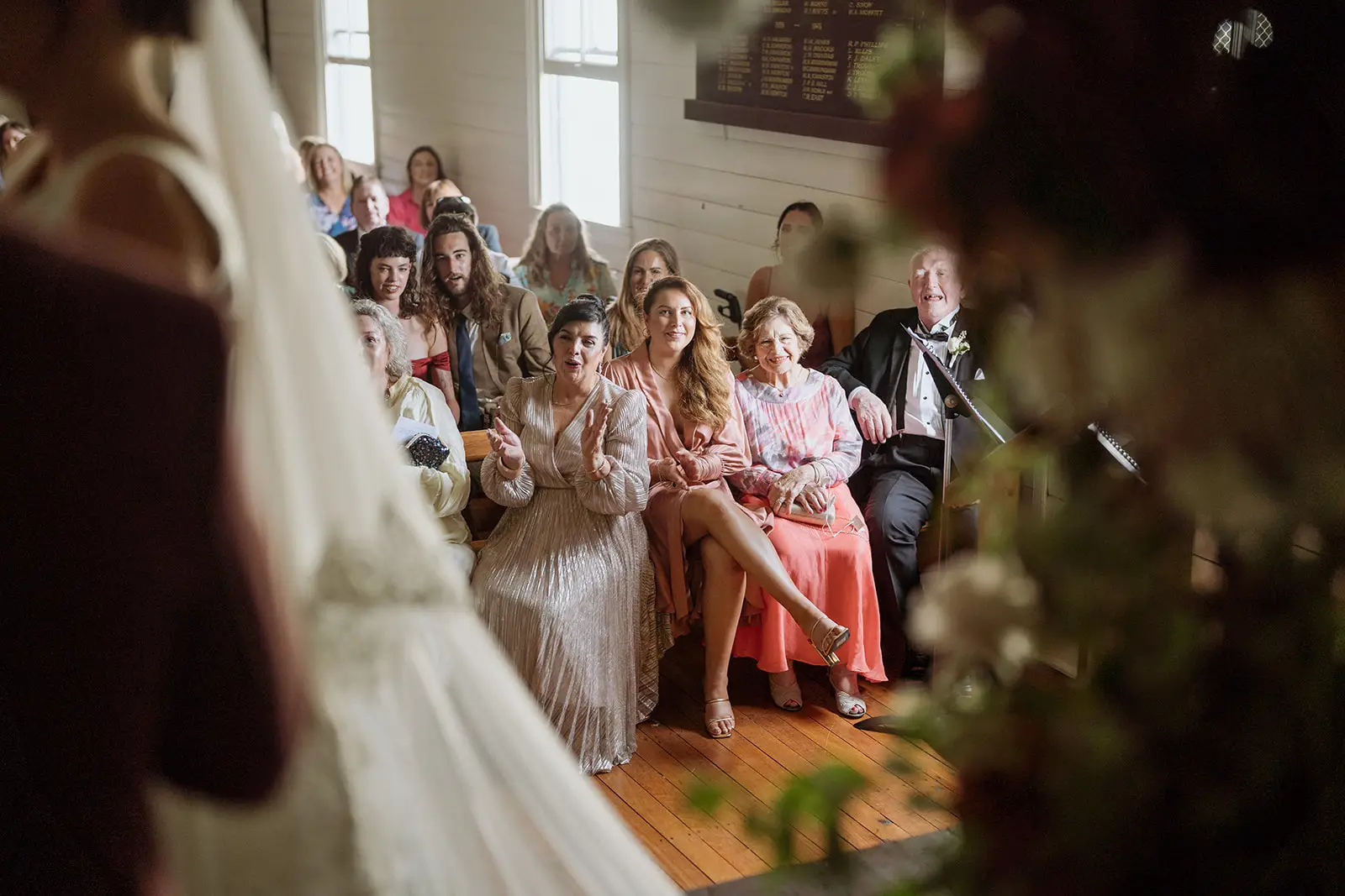 The ceremony seen past the hanging florals, Newrybar