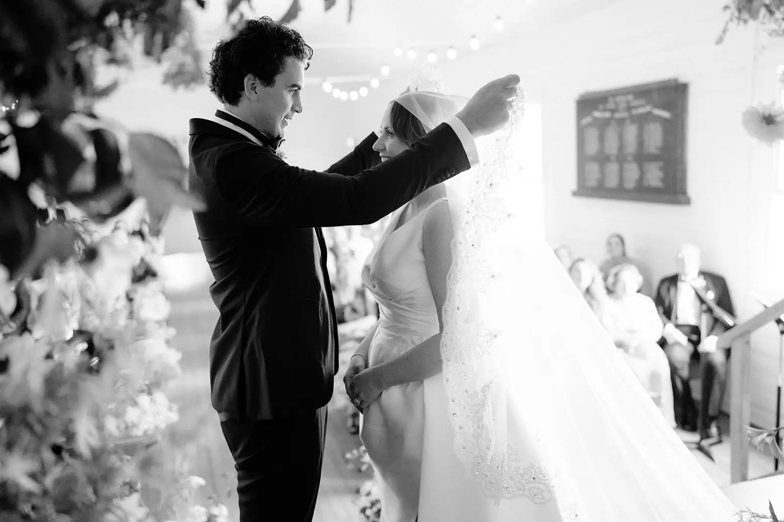 Tom lifting Nim's veil during the ceremony, Newrybar hall