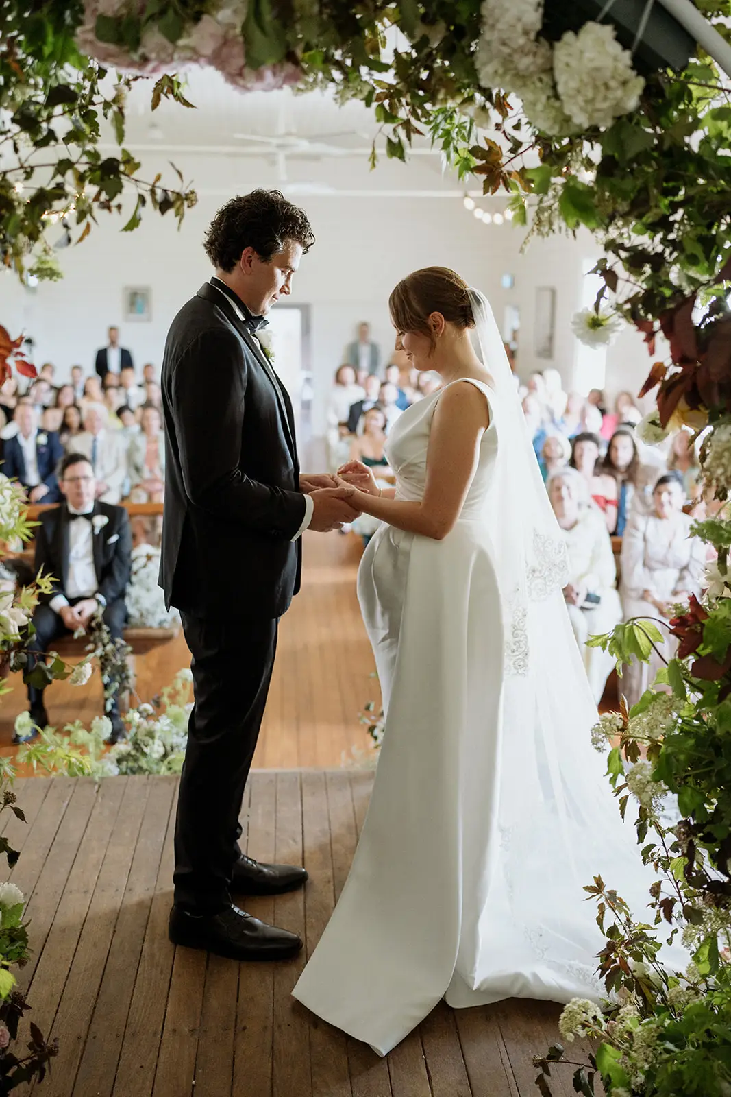 Exchanging vows at the Newrybar School of Arts hall