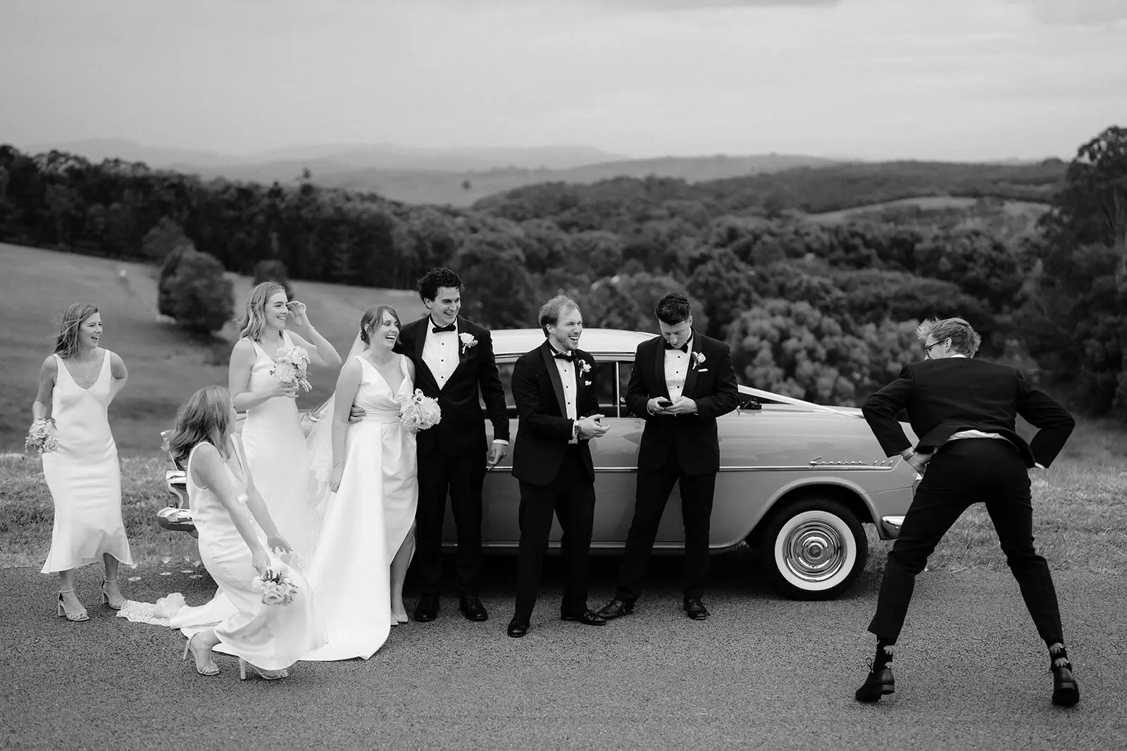 The bridal party larking about by the car, Newrybar