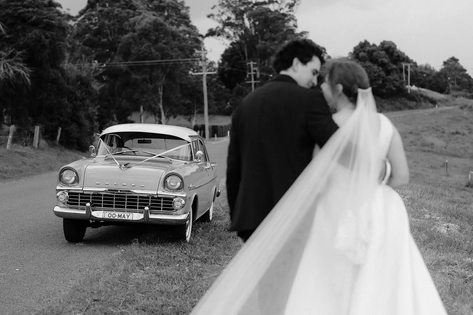 Tom and Nim walking behind the vintage car, Byron Bay hinterland