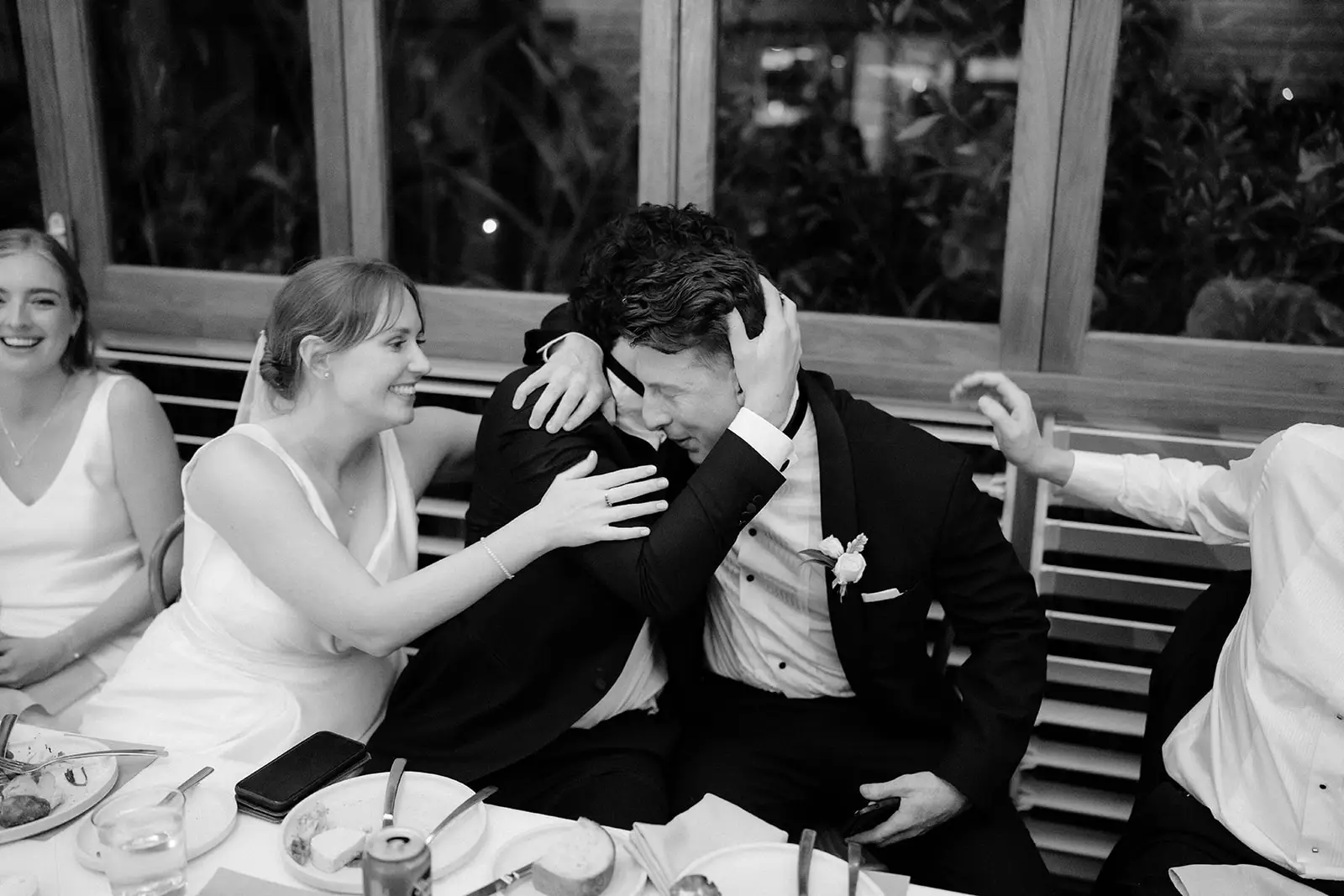 Nim laughing into Tom's shoulder during the speeches, Harvest