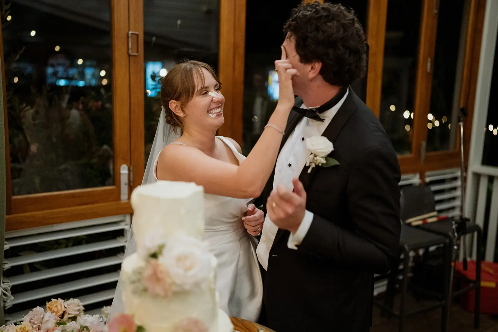 Feeding each other cake at the reception, Harvest Newrybar