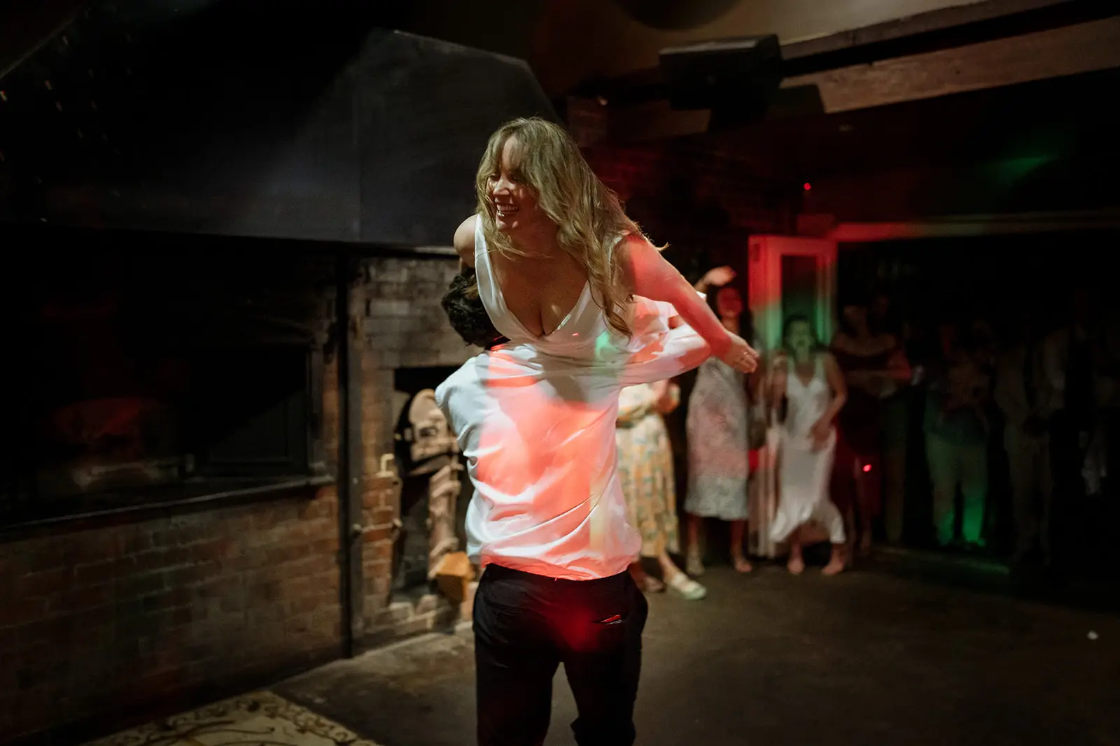 A guest dancing in the courtyard at night, Harvest Newrybar