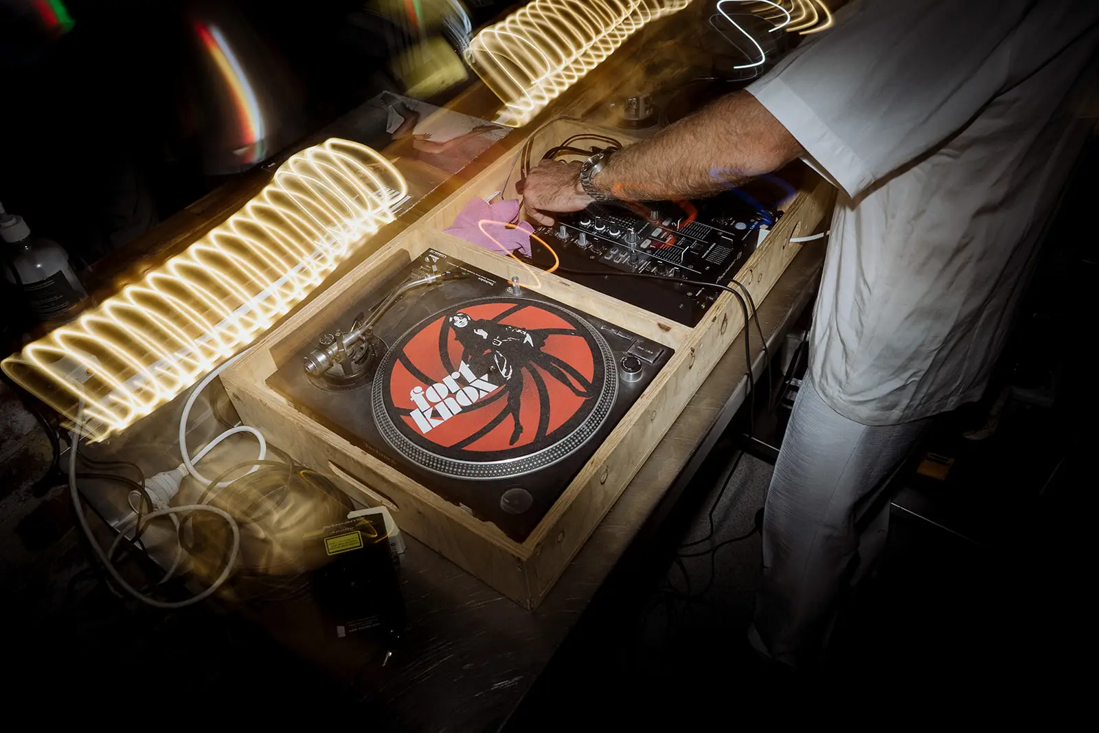 The DJ cueing a record at the reception, Harvest Newrybar