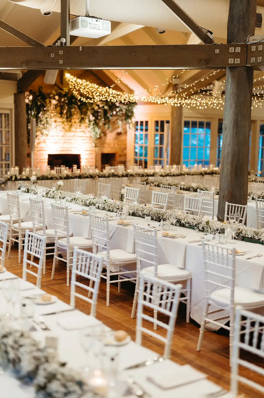 The room set with chiavari chairs and greenery down the tables, InterContinental Sanctuary Cove