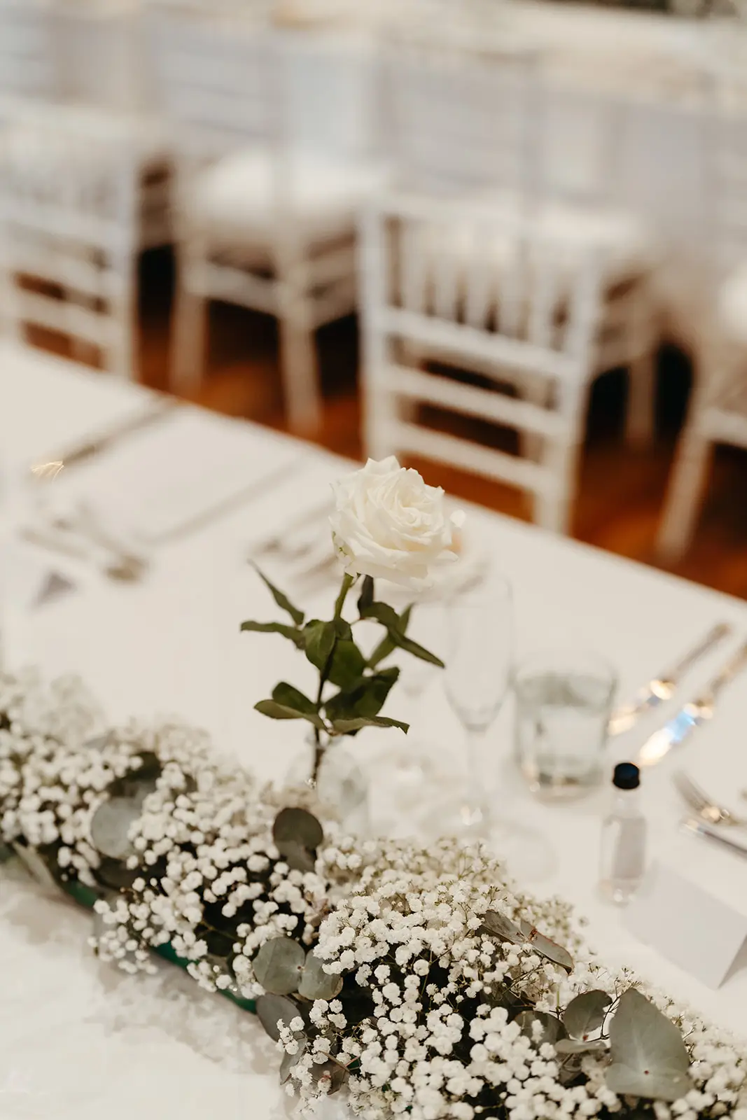 A bud vase and baby’s breath on the table runner, InterContinental Sanctuary Cove