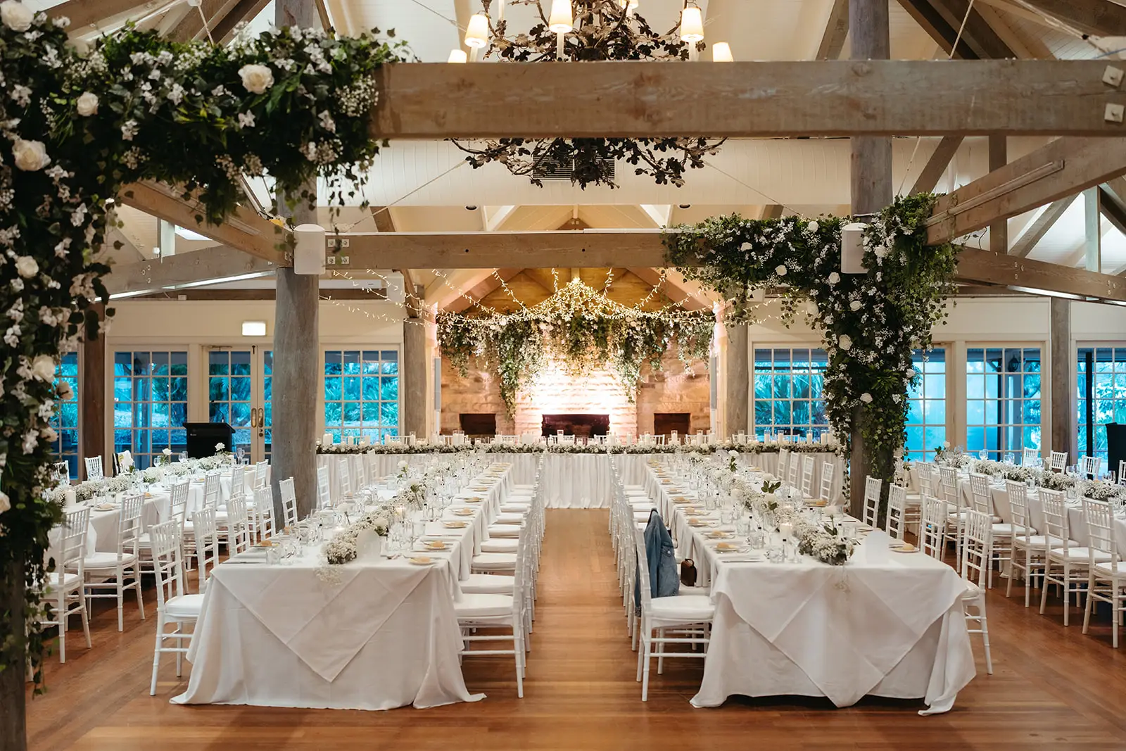 The reception room dressed with greenery and long tables, InterContinental Sanctuary Cove