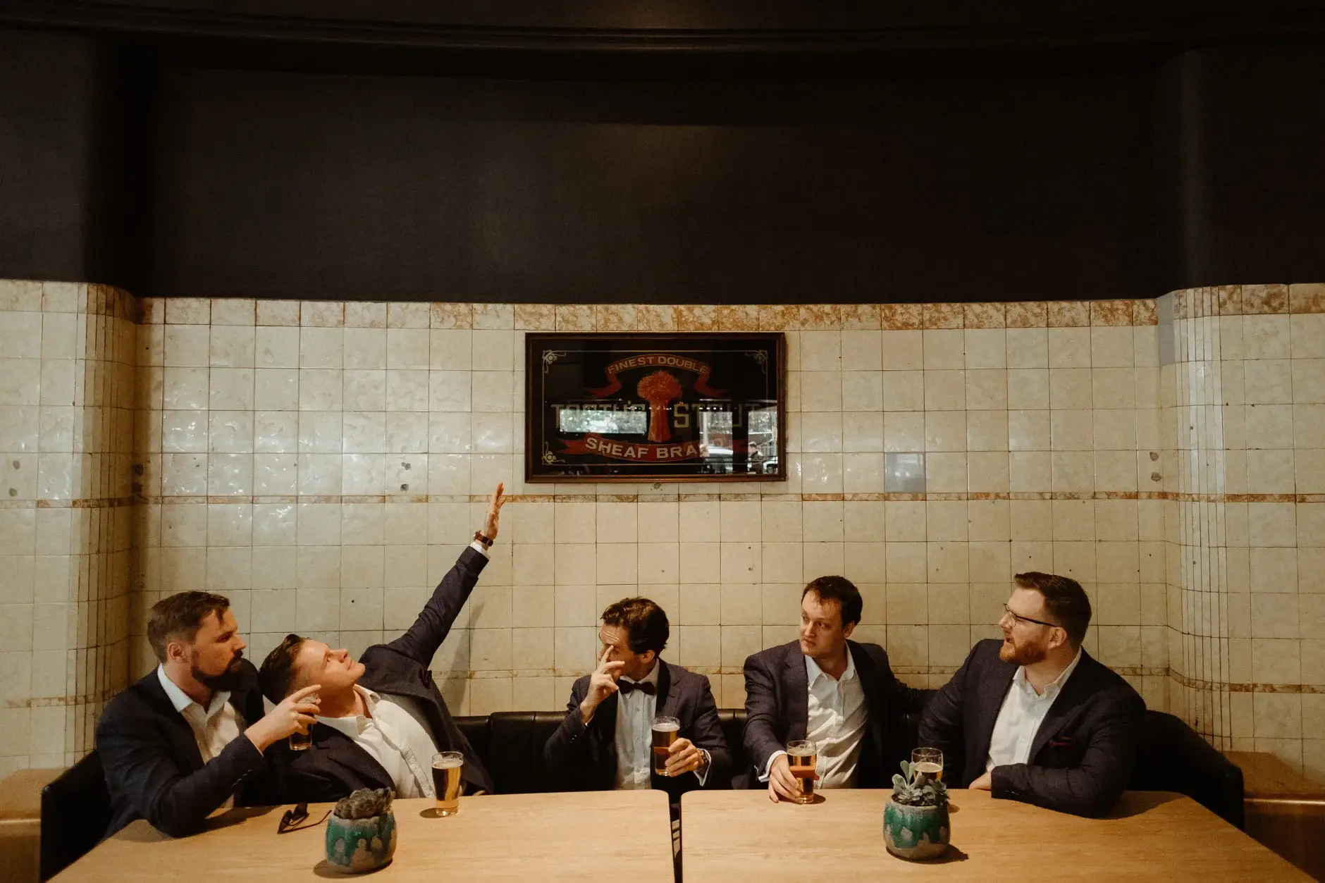 Ross and the groomsmen laughing in the tiled bar, The Old Clare Hotel
