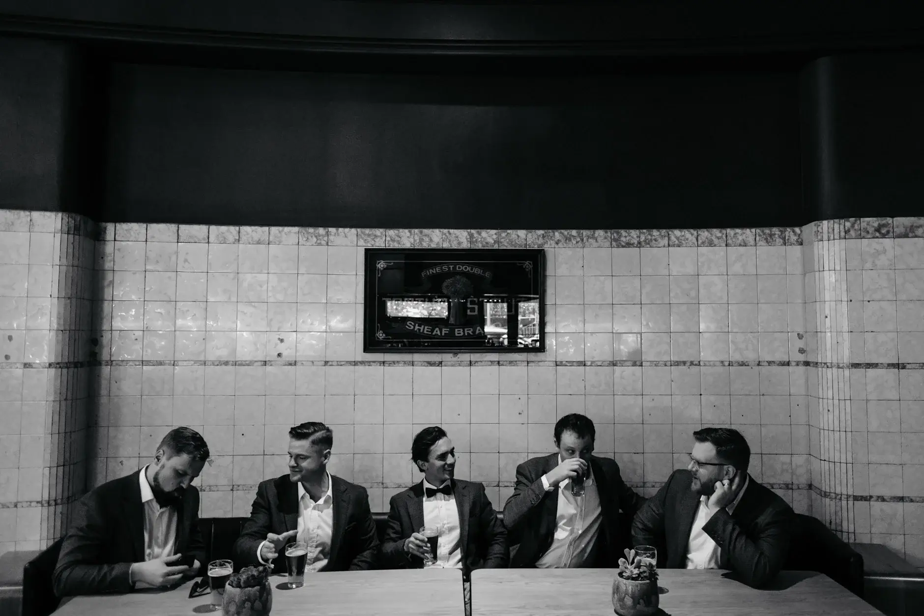 The groomsmen in the tiled bar, black and white, The Old Clare Hotel