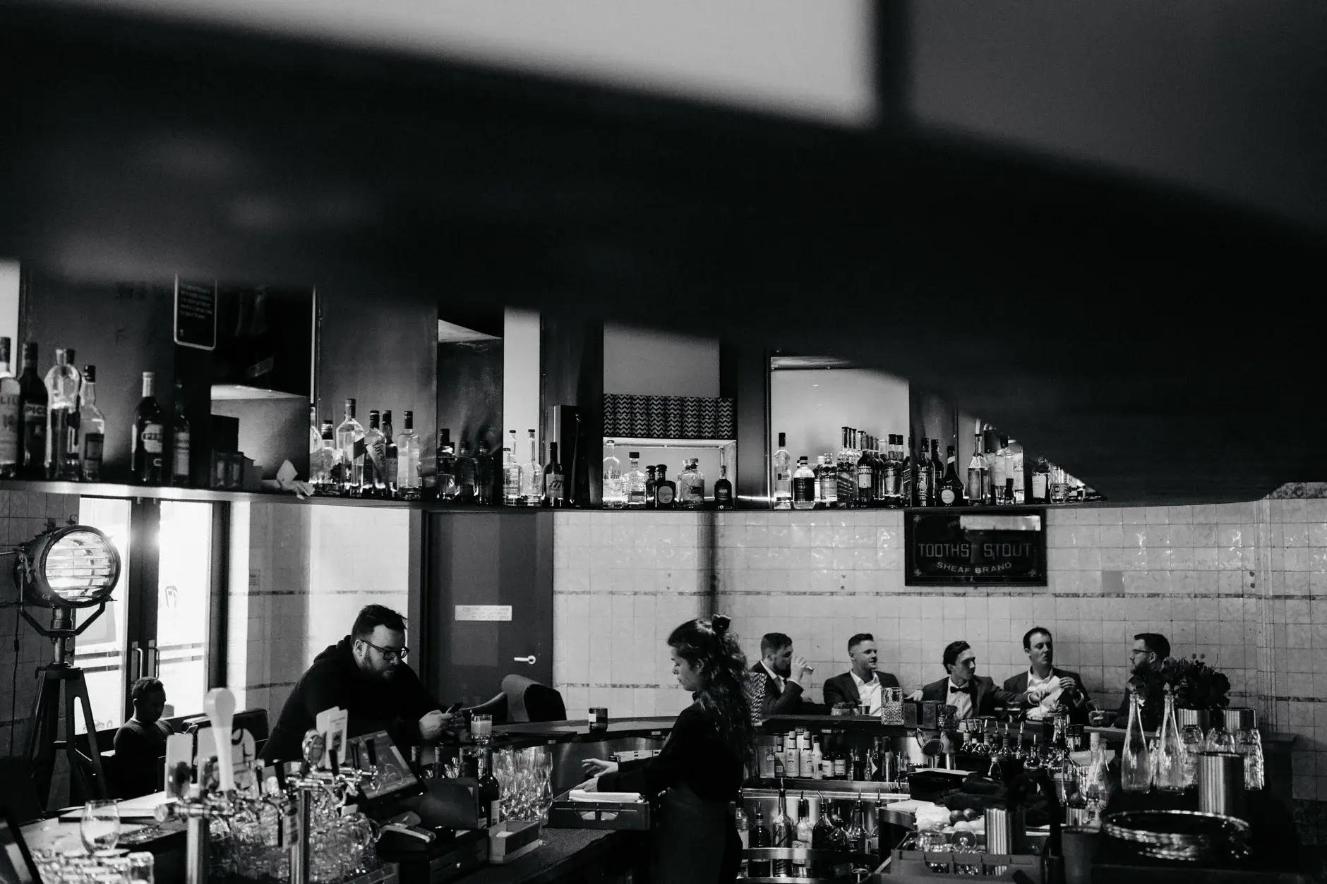 The bar seen from across the room, black and white, The Old Clare Hotel