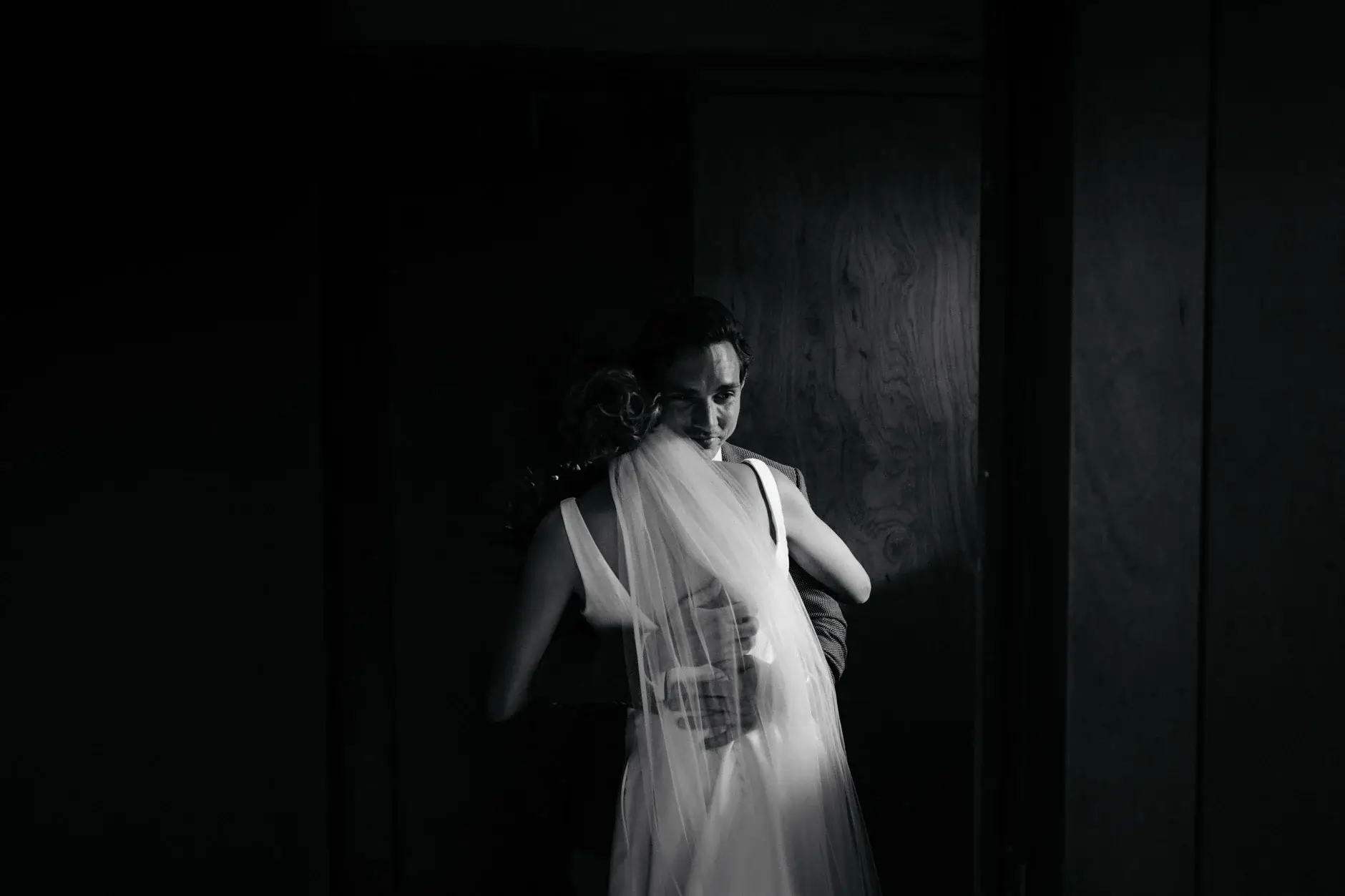 Kath in her dress against the dark panelling, black and white, The Old Clare Hotel
