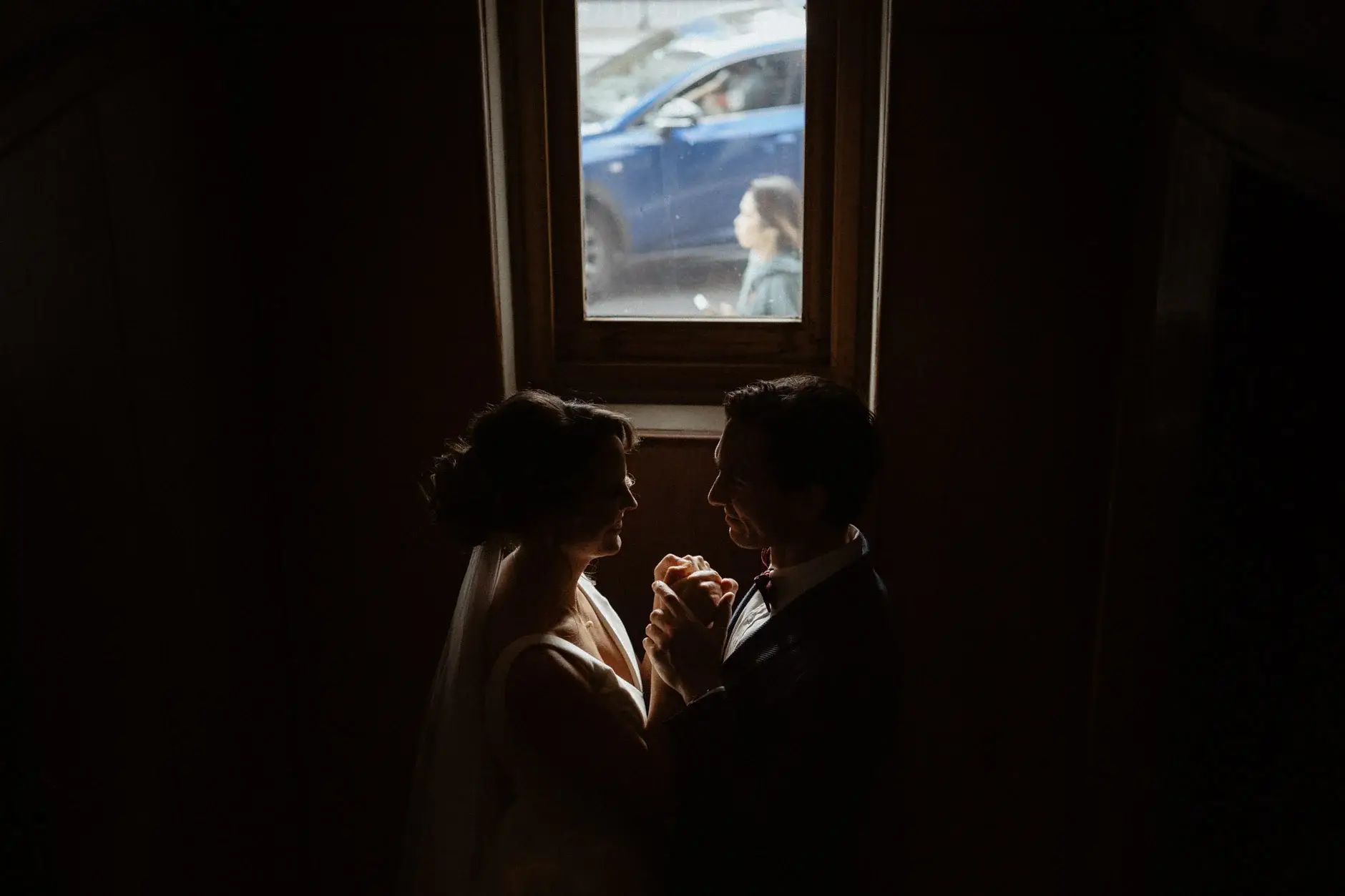 Kath and Ross close together in the dark corridor, The Old Clare Hotel