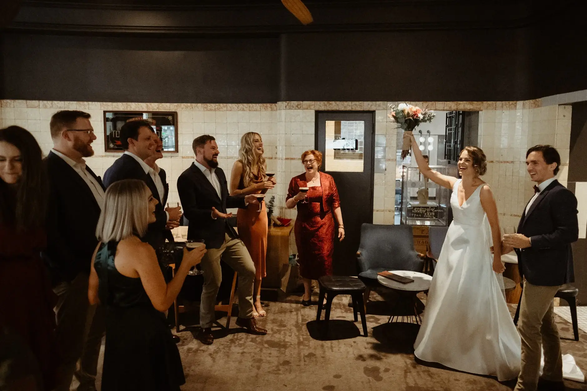 Kath raising her bouquet to the room, The Old Clare Hotel