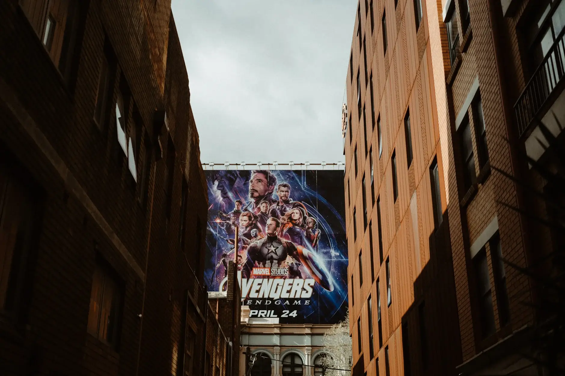 The laneway with a film billboard on the brick wall, Chippendale