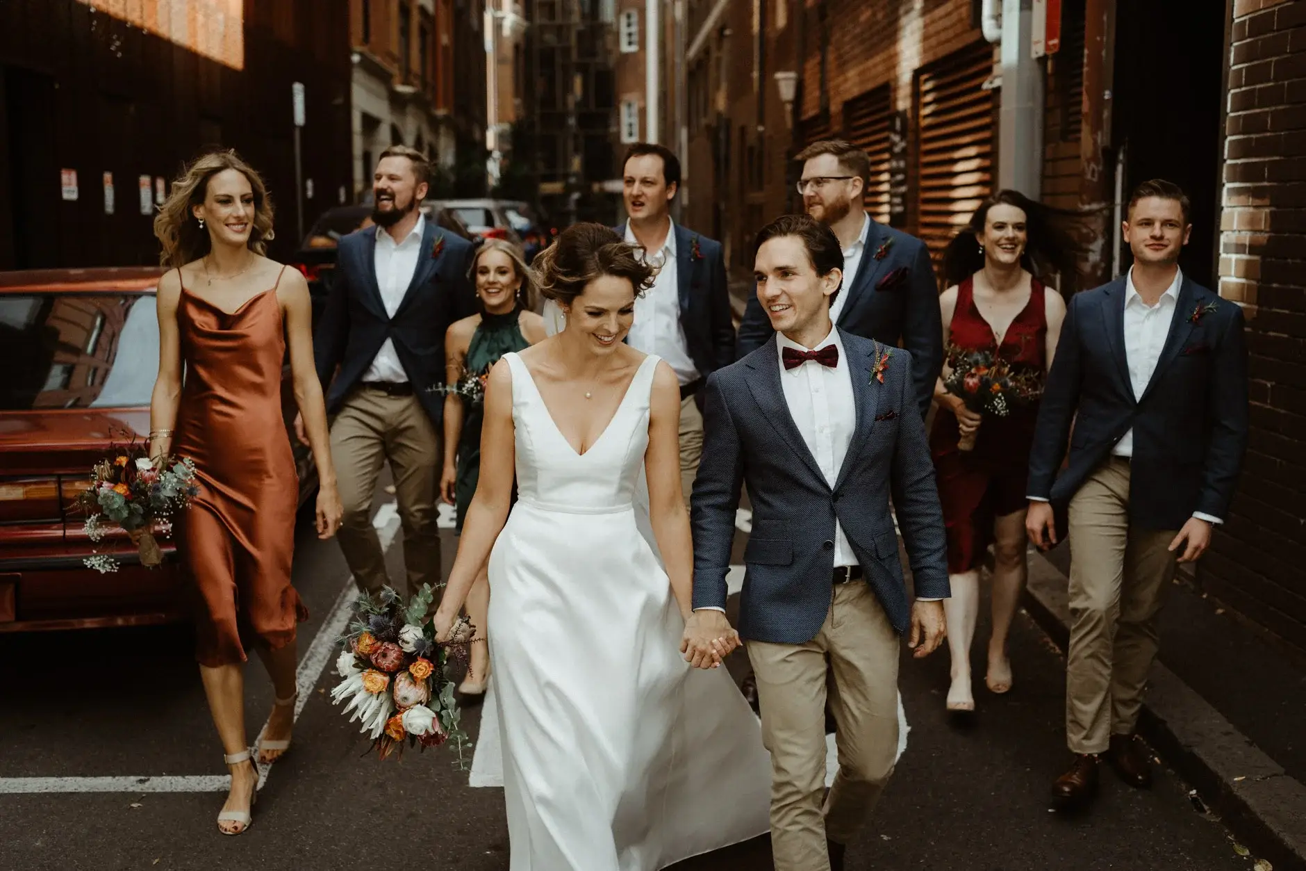 The whole bridal party walking the laneway together, Chippendale
