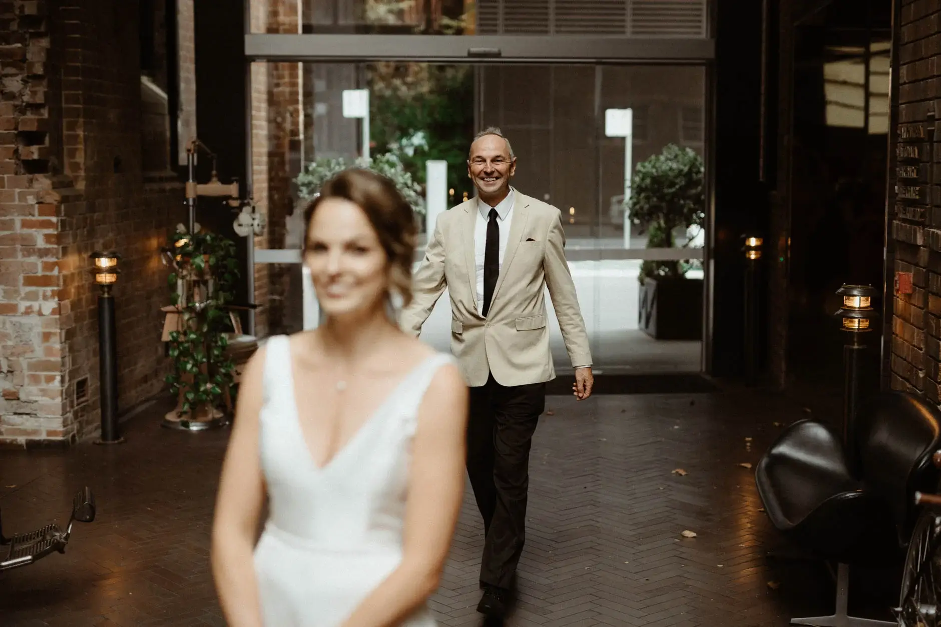 Kath and Ross walking towards the camera in the laneway, Chippendale