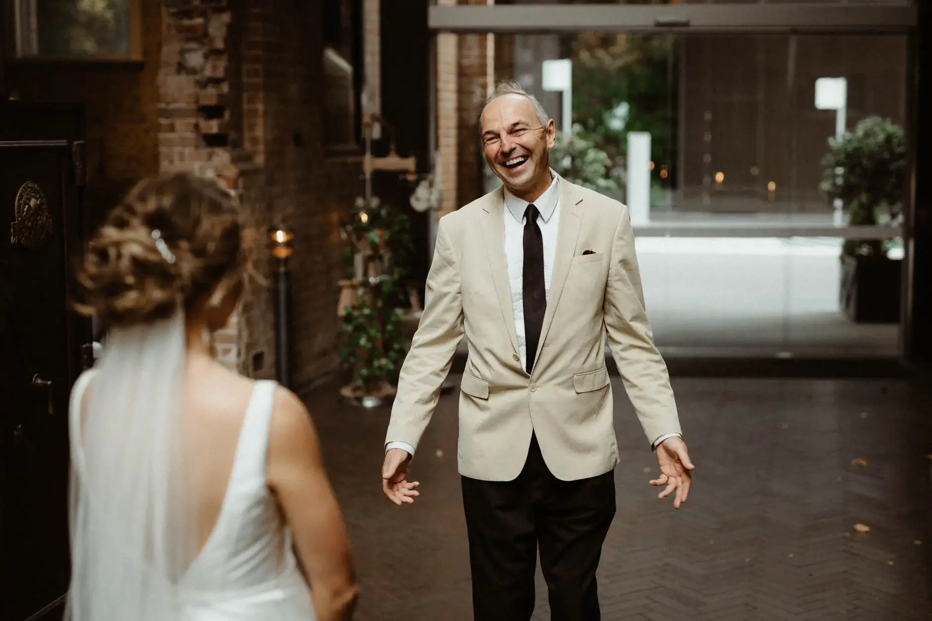 Kath greeting her father in the laneway, Chippendale