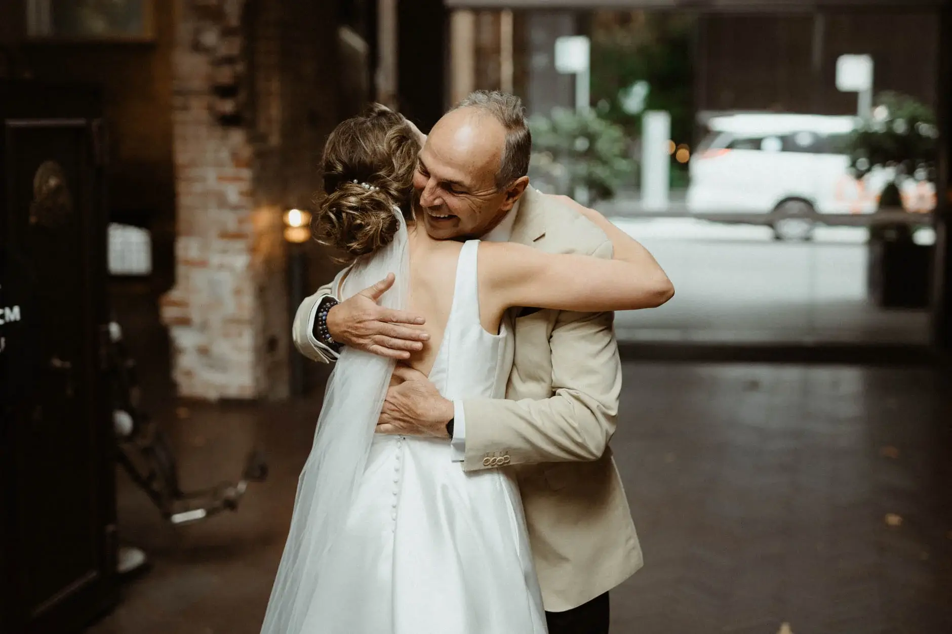 Kath and her father embracing in the street, Chippendale