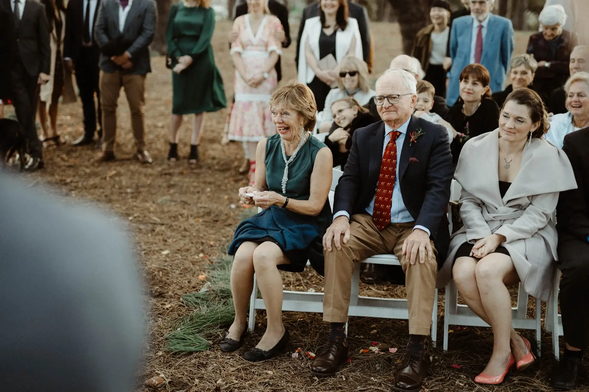Guests seated on a bench watching the ceremony, Centennial Park
