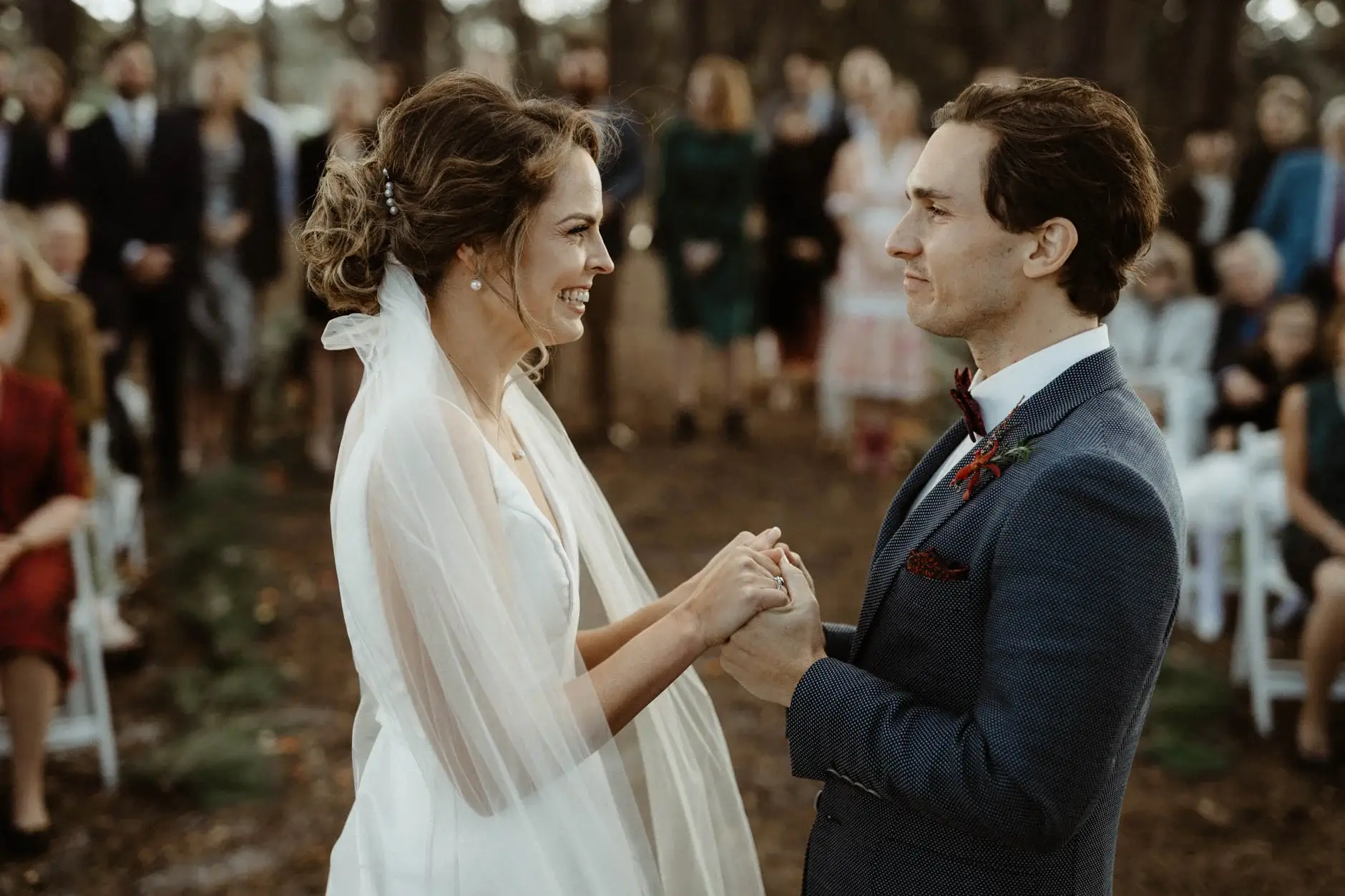 Kath and Ross holding hands as they are married, Centennial Park