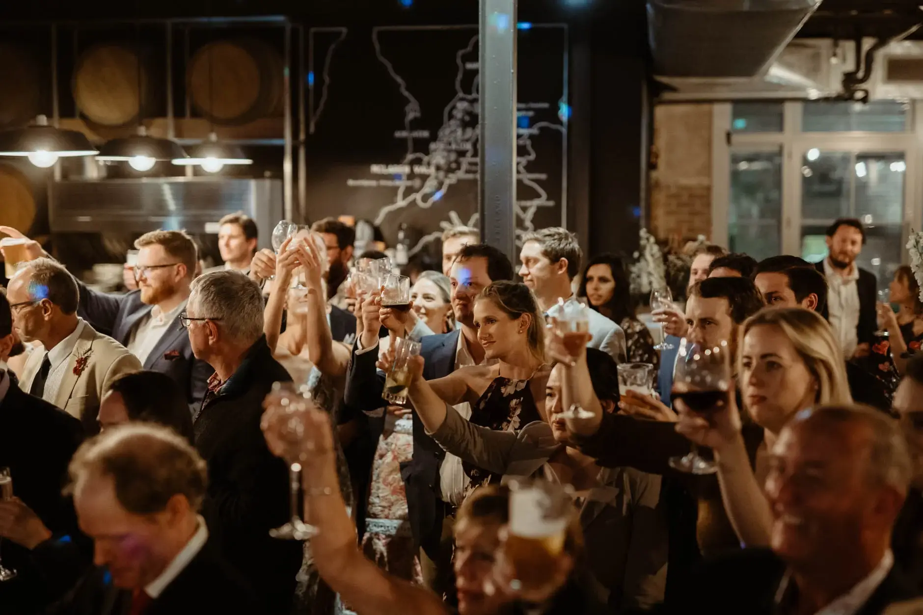 The whole room raising glasses for a toast, Cake & Wine, Redfern