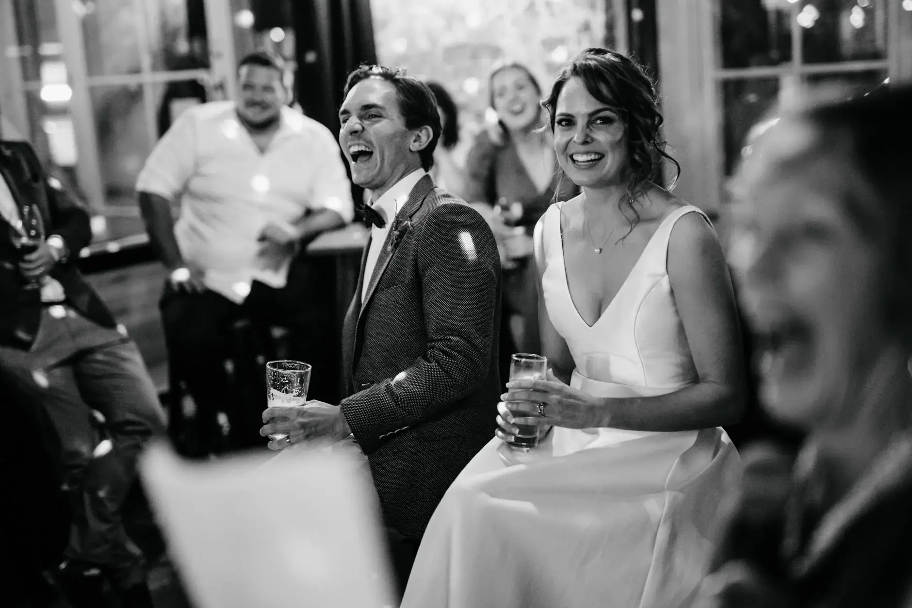 Kath and Ross laughing during the speeches, black and white, Redfern
