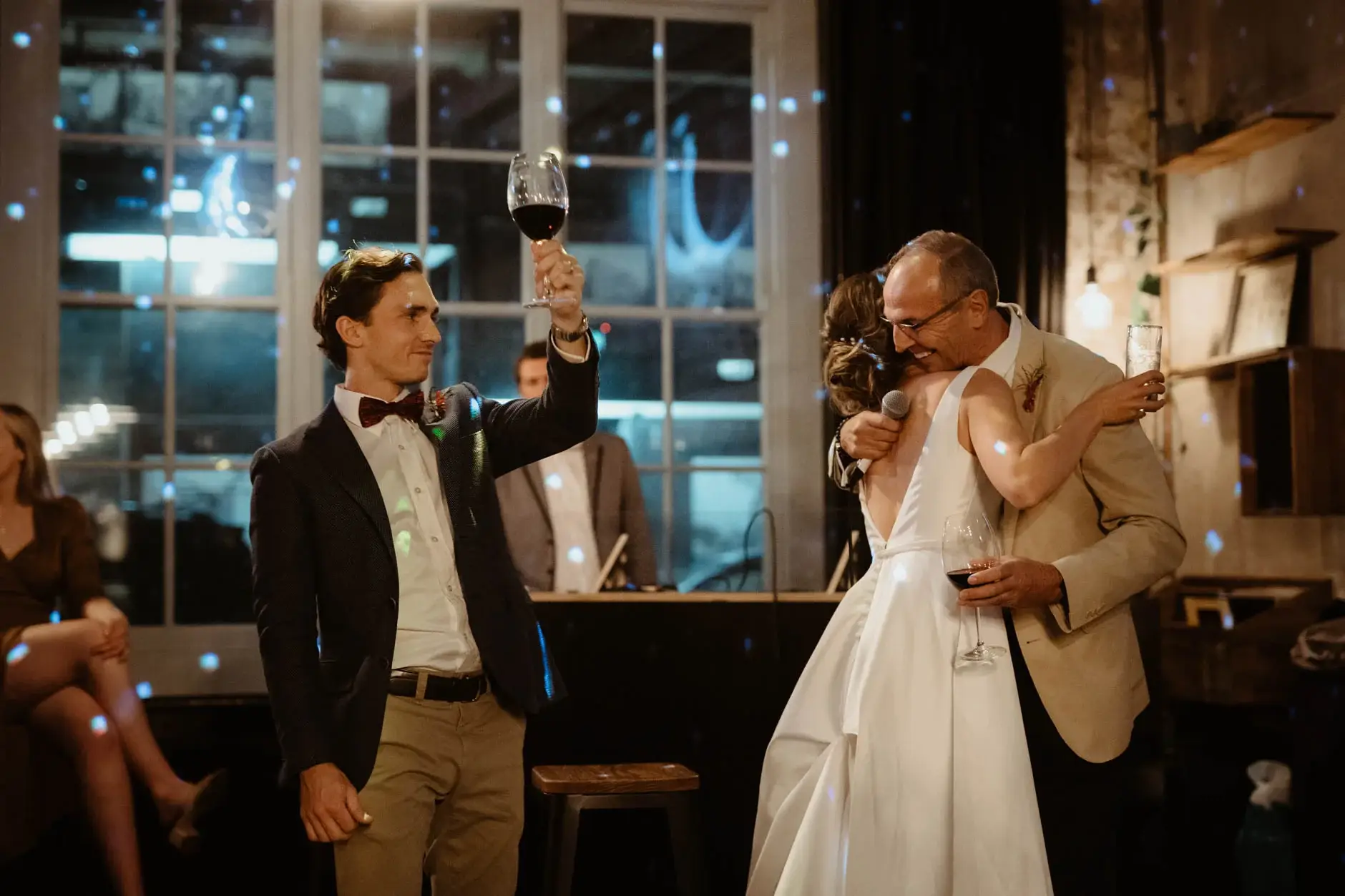 Ross raising a glass beside Kath during a toast, Redfern