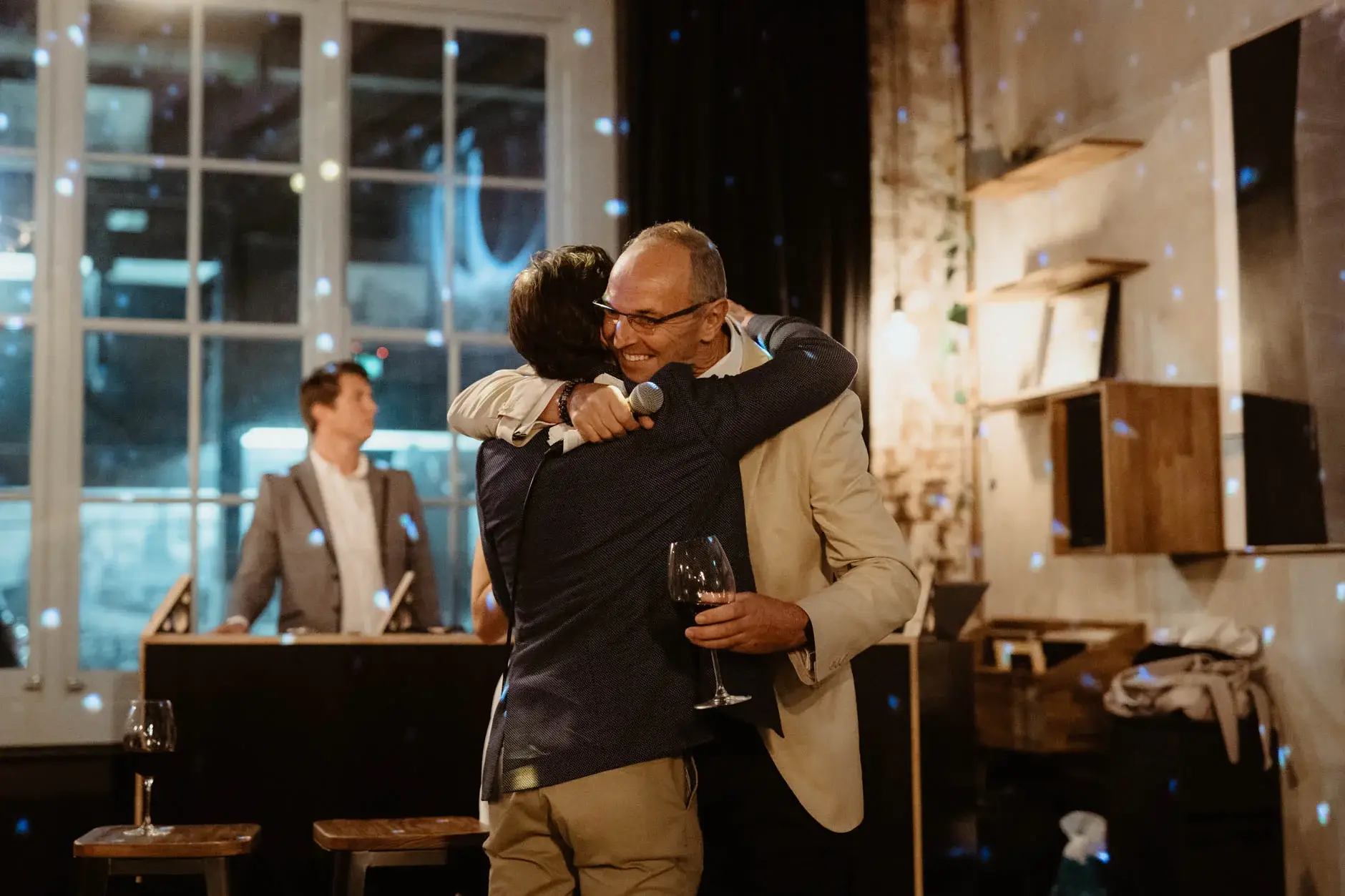 Ross embracing a friend after the speeches, Redfern